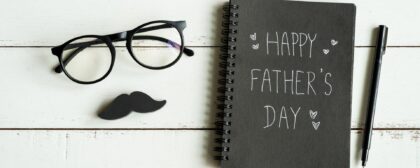 Happy Father's Day message on notebook with white background