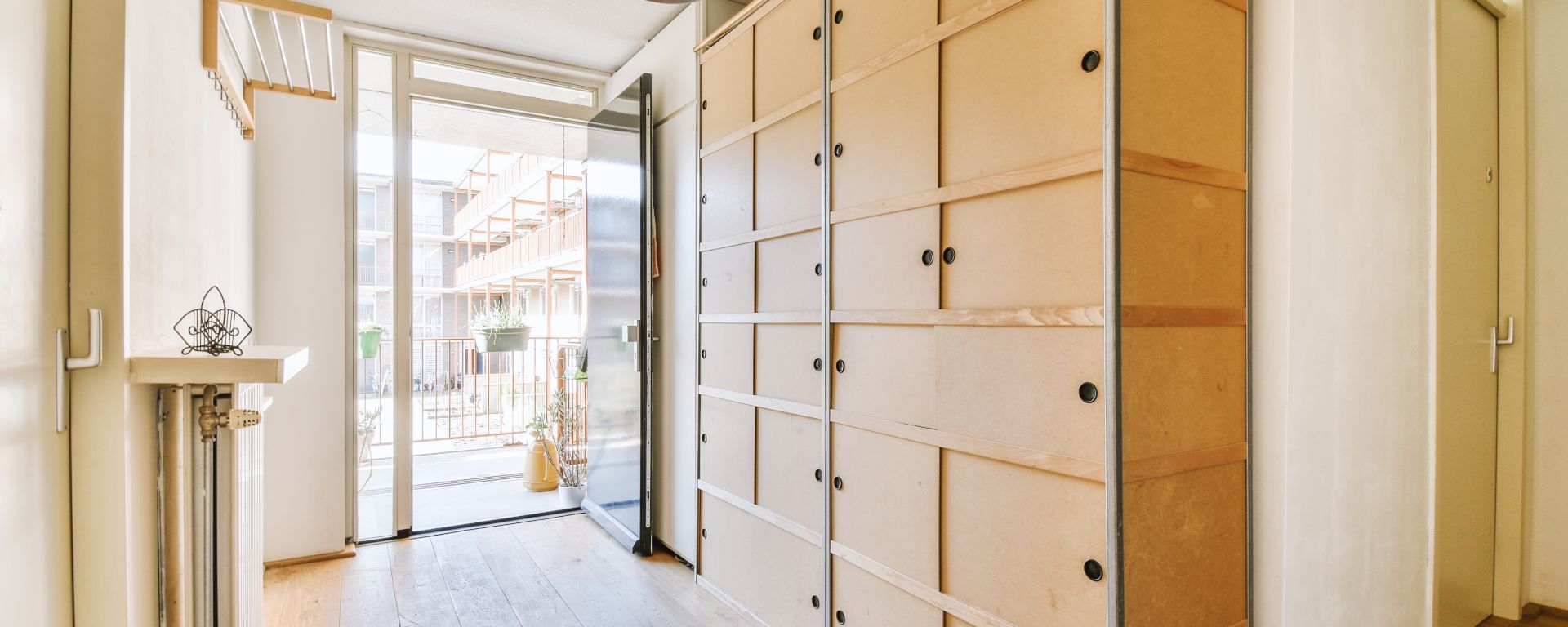 Hallway in home with plenty of cupboard space.